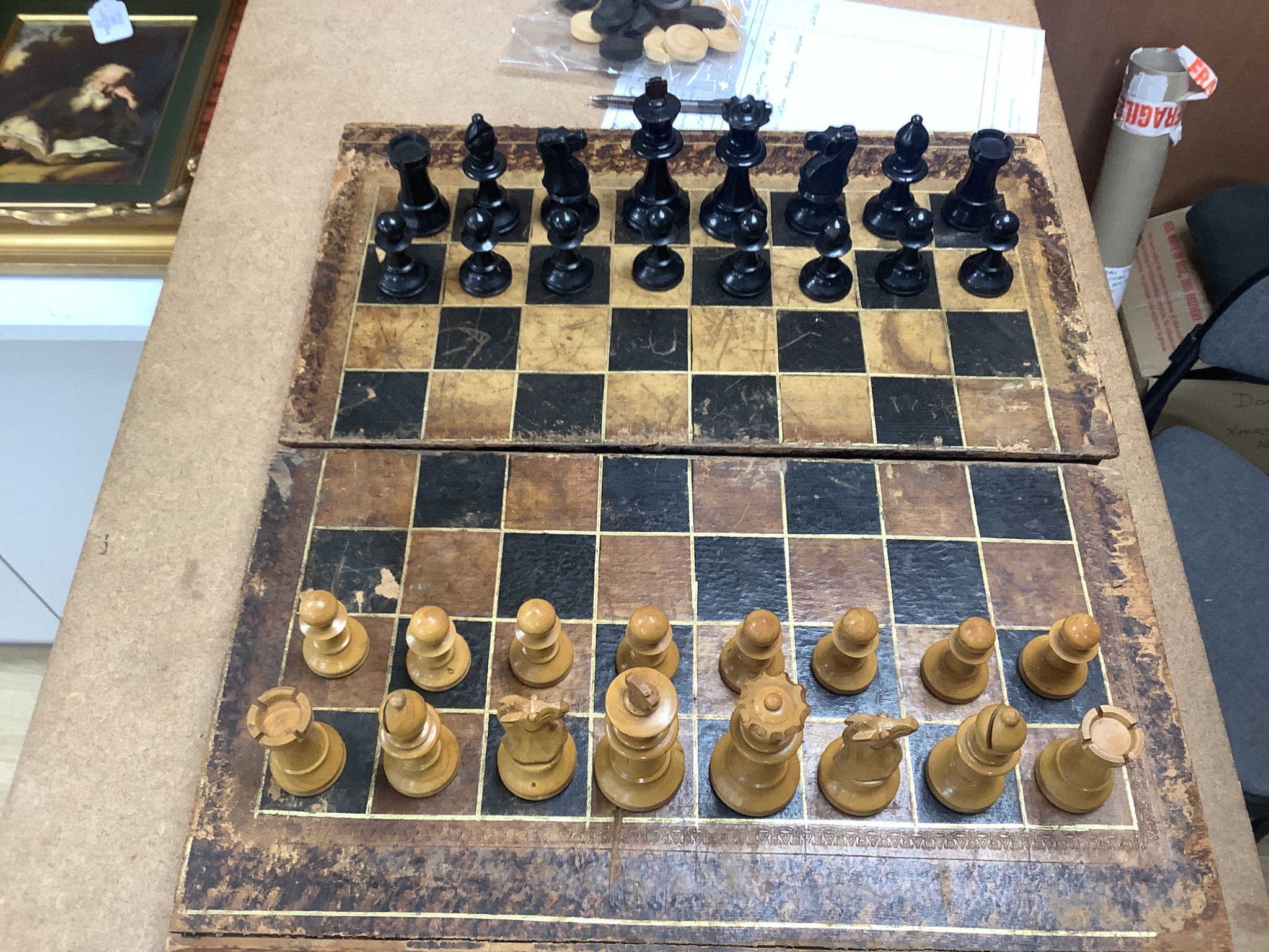 A 19th century faux book chessboard and turned wood chess set